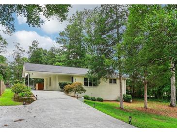 House exterior with driveway and landscaping at 679 Forest Ridge Se Dr, Marietta, GA 30067