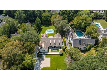 Luxury home with expansive lawn, pool, and guest house at 2880 Bakers Farm Se Rd, Atlanta, GA 30339