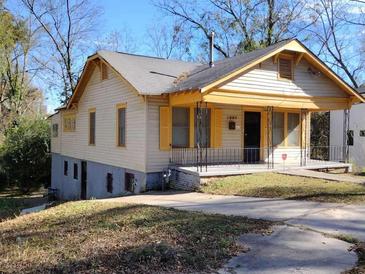 Charming yellow and beige house with a spacious front porch at 1005 Ashby Ter, Atlanta, GA 30314