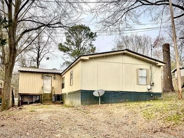 Single-wide manufactured home with yard at 2646 Lakeshore Ne Dr, Conyers, GA 30012