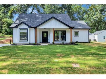 Charming craftsman style home with a front yard at 2000 Grove Ave, East Point, GA 30344