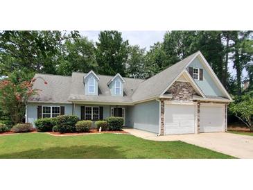 Two-story house with two-car garage at 221 Bridgemill Ln, Hampton, GA 30228