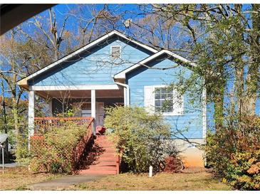 Charming blue house with a front porch and stairs at 1352 Wylie Se St, Atlanta, GA 30317