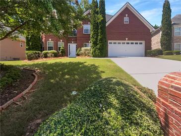 Two story brick house with attached garage at 2669 Saint Paul Sw Dr, Atlanta, GA 30331