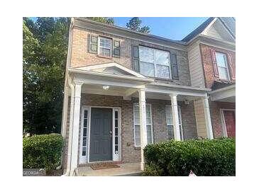 Brick two story townhome with covered porch at 4870 Hairston Park Sq, Stone Mountain, GA 30083