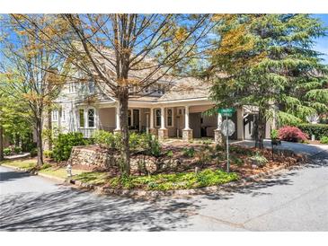 Charming two-story home with stone accents and landscaped yard at 7160 Round Rd, Cumming, GA 30040