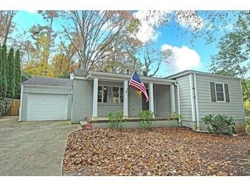 Charming ranch home with gray siding and covered porch at 1715 Moores Mill Rd, Atlanta, GA 30318