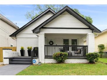 Charming white bungalow with black accents and porch at 976 Washington St, Atlanta, GA 30315