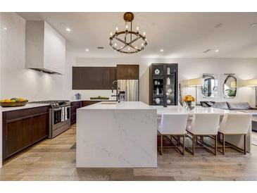 Modern kitchen with island, stainless steel appliances, and dark wood cabinetry at 330 Heatherden Ave, Fayetteville, GA 30214
