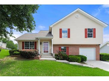 Two-story house with red shutters and attached garage at 3419 River Run Trl, Decatur, GA 30034