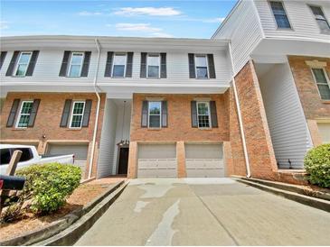 Brick front townhouse with double garage at 502 Brandywine Cir, Atlanta, GA 30350