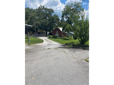 Long driveway leading to barn and other outbuildings at 3749 Centerville Rosebud Rd, Snellville, GA 30039