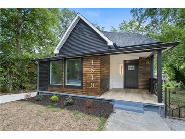 Stylish craftsman home with dark exterior and wood accents at 1510 Mims Sw St, Atlanta, GA 30314