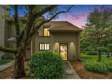 Townhouse exterior at dusk with landscaping at 3630 Stonewall Se Dr, Atlanta, GA 30339