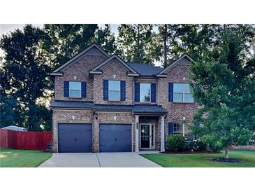 Two-story brick home with a two car garage at 9378 Lantana Trl, Jonesboro, GA 30238