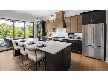 Modern kitchen with large island and stainless steel appliances at 3012 Sunset Pass, Canton, GA 30114
