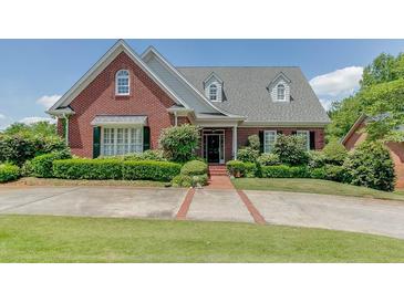 Brick house with landscaping at 265 Regal Dr, Lawrenceville, GA 30046
