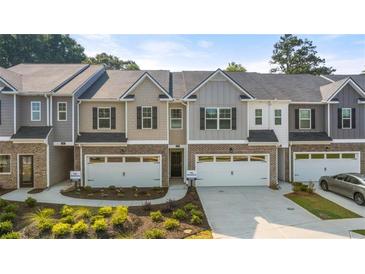 Two-story townhouses with attached garages and landscaping at 348 Elgin Dr # 162, Lawrenceville, GA 30045