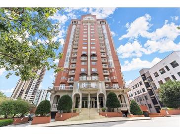 Brick building exterior with grand entrance and landscaping at 3435 Kingsboro Ne Rd # 1201, Atlanta, GA 30326