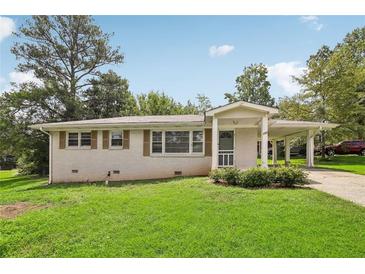 Charming ranch home with a well-maintained lawn at 107 Gladstone Sw Dr, Marietta, GA 30060
