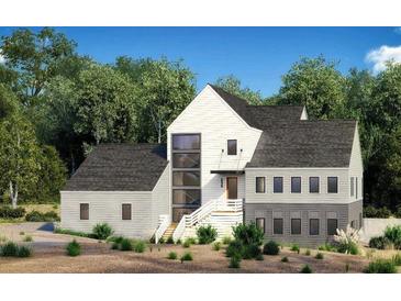 Modern farmhouse exterior with gray and white siding at 235 Winterberry Way, Roswell, GA 30075