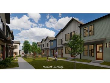 Exterior view of townhouses with a shared courtyard and green space at 1070 Dill Sw Ave, Atlanta, GA 30310
