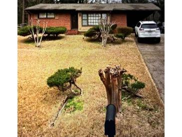 Ranch style home with brick exterior and a small front yard at 3430 Longleaf Dr, Decatur, GA 30032