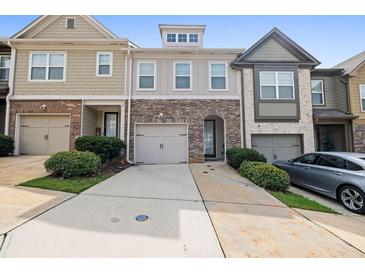Modern townhome with two-car garage and landscaping at 2314 Rolling Trl, Lithonia, GA 30058