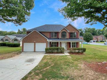 Brick two-story house with a two-car garage at 1869 Watercrest Dr, Jonesboro, GA 30236