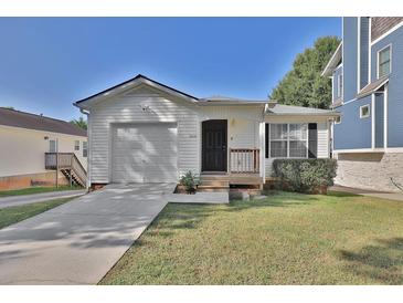 Single-story house with attached garage and front yard at 3126 Lynwood Ne Dr, Brookhaven, GA 30319