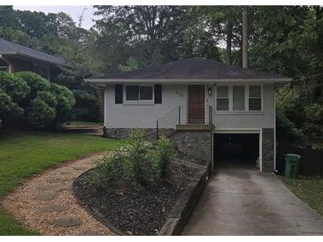 Charming ranch home with attached garage and landscaped yard at 2121 Arlington Ne Ave, Atlanta, GA 30324