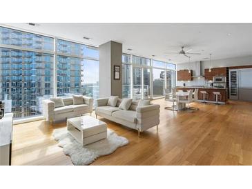 Modern living room with hardwood floors and city views at 45 Ivan Allen Jr. Nw Blvd # 2501, Atlanta, GA 30308
