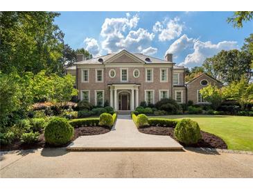 Brick house with landscaped yard and walkway at 3560 Ridgewood Nw Rd, Atlanta, GA 30327