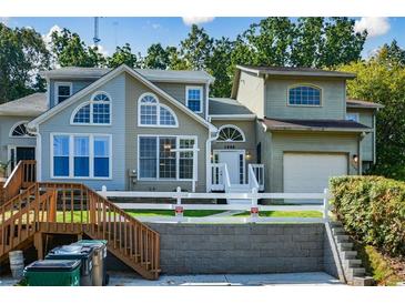 Two-story townhome with a landscaped yard and attached garage at 1666 Paddlewheel Dr, Marietta, GA 30062
