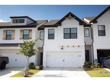 Modern two-story townhome with white exterior at 51 S Auburn Landing Pl # 51, Auburn, GA 30011