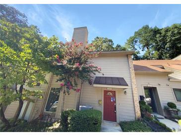 Townhouse exterior with red door and landscaping at 3805 Stonewall Se Ter # 3805, Atlanta, GA 30339