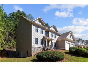 Two-story house with stone accents and landscaping at 906 Fox Croft Pl, Canton, GA 30114
