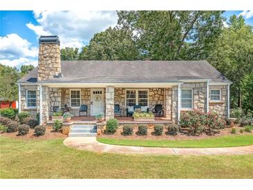 Charming stone ranch house with a covered porch at 3112 Highway 155 N, Mcdonough, GA 30252