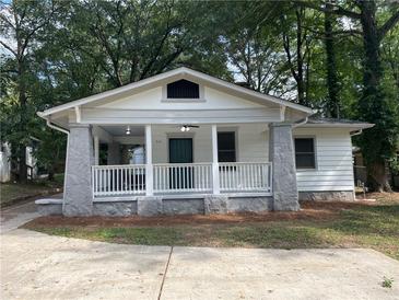 Charming bungalow with front porch and stone columns at 916 Cascade Sw Rd, Atlanta, GA 30311