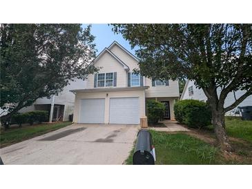 Two story home with double garage and mature landscaping at 3008 Summer Breeze Dr, Villa Rica, GA 30180