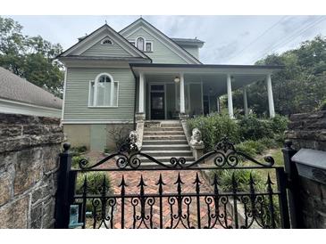 Charming two-story home with ornate gate at 490 Hill Se St, Atlanta, GA 30312