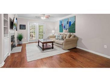 Spacious living room with hardwood floors and a fireplace at 3655 Habersham Ne Rd # 215, Atlanta, GA 30305