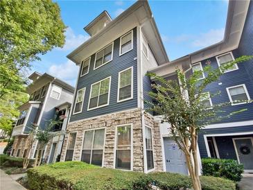 Three-story building with blue siding and stone accents at 1575 Ridenour Nw Pkwy # 804, Kennesaw, GA 30152
