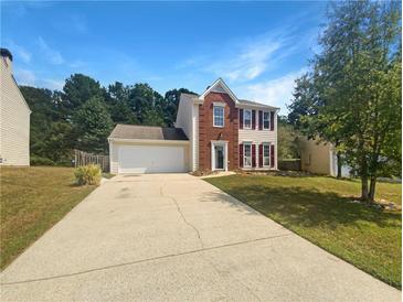 Two story brick home with attached garage and driveway at 2959 Heather Lake Dr, Austell, GA 30106