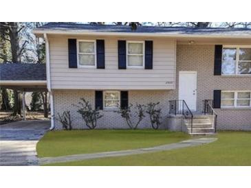 Two-story home with brick facade and landscaped yard at 2900 Bradmoor Ct, Decatur, GA 30034