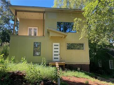 Modern two-story home with large windows and deck at 1787 Pennington Se Pl, Atlanta, GA 30316