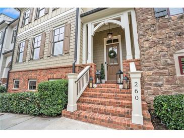 Inviting home exterior with brick and siding at 260 Trecastle Sq, Canton, GA 30114