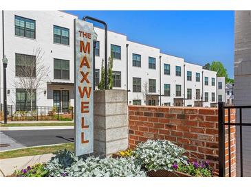 The Maxwell community features modern townhouses with brick accents at 201 Devore Rd, Alpharetta, GA 30009