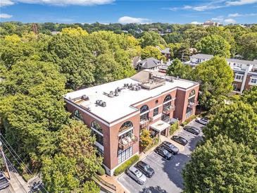 Brick building with rooftop deck and ample parking at 790 North Ne Ave # 204, Atlanta, GA 30306