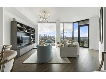 Modern living room with city views and hardwood floors at 788 West Marietta St # 1604, Atlanta, GA 30318